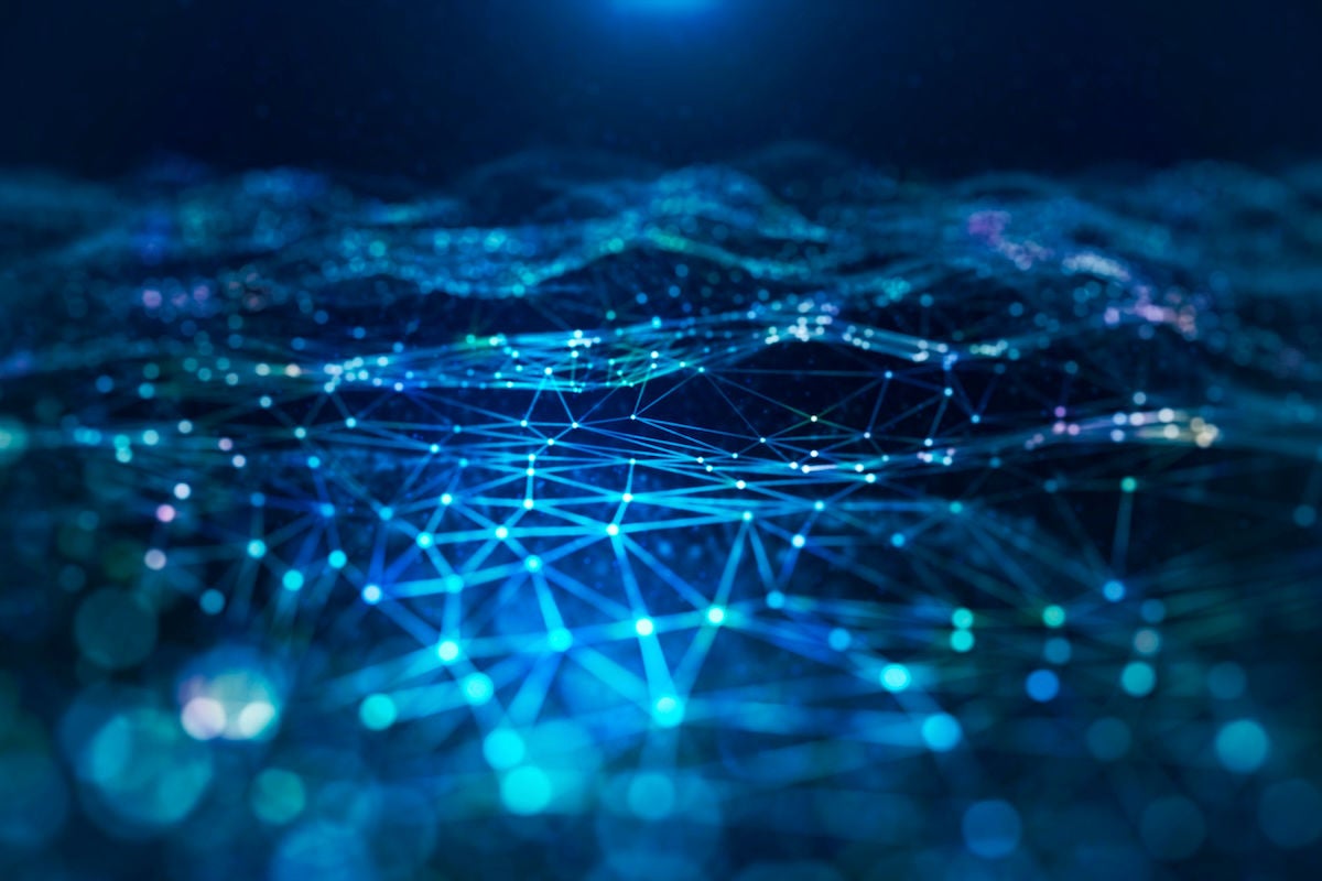 Blue glowing wire network with a light on dark background.