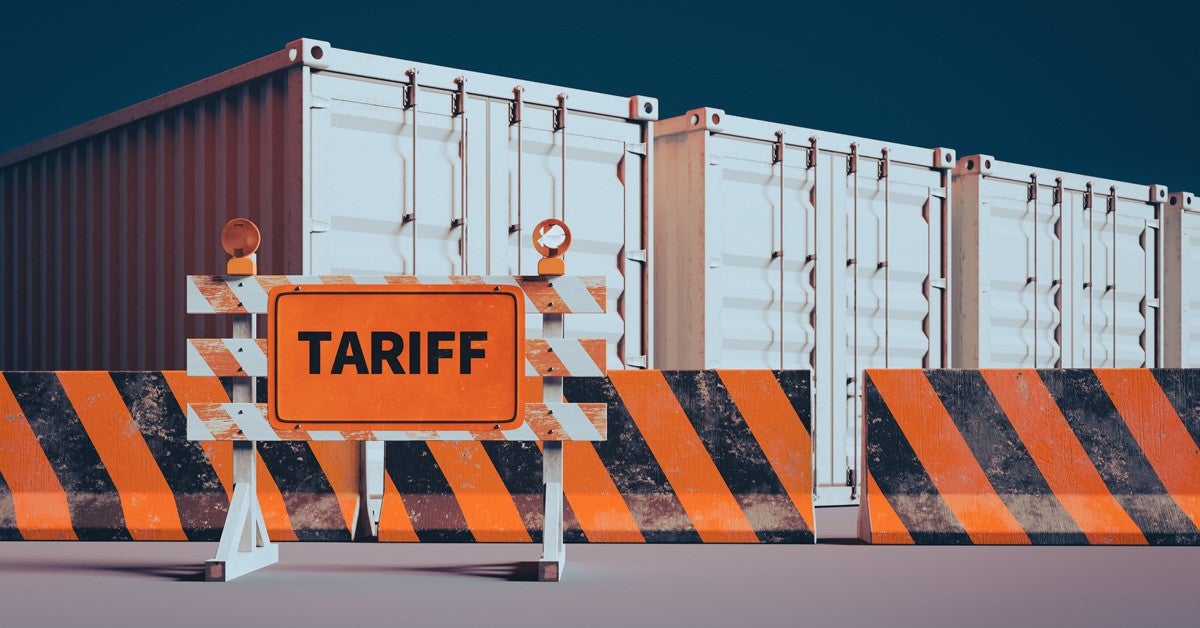 Image with shipping containers and a sign reading tariffs