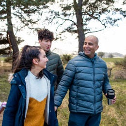 group of people walking in nature