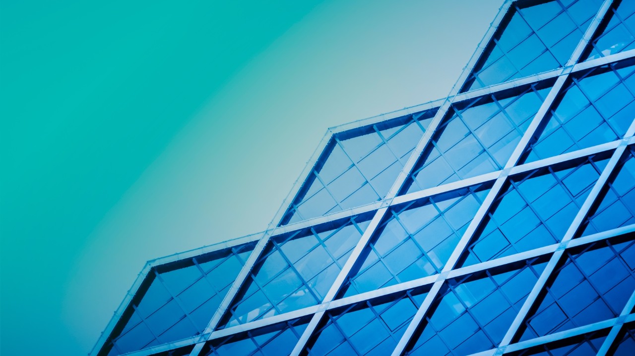 close up view of geometric building in aqua and blue