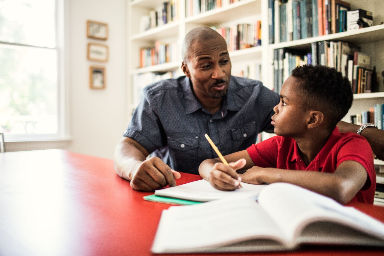 Father helping son with homework