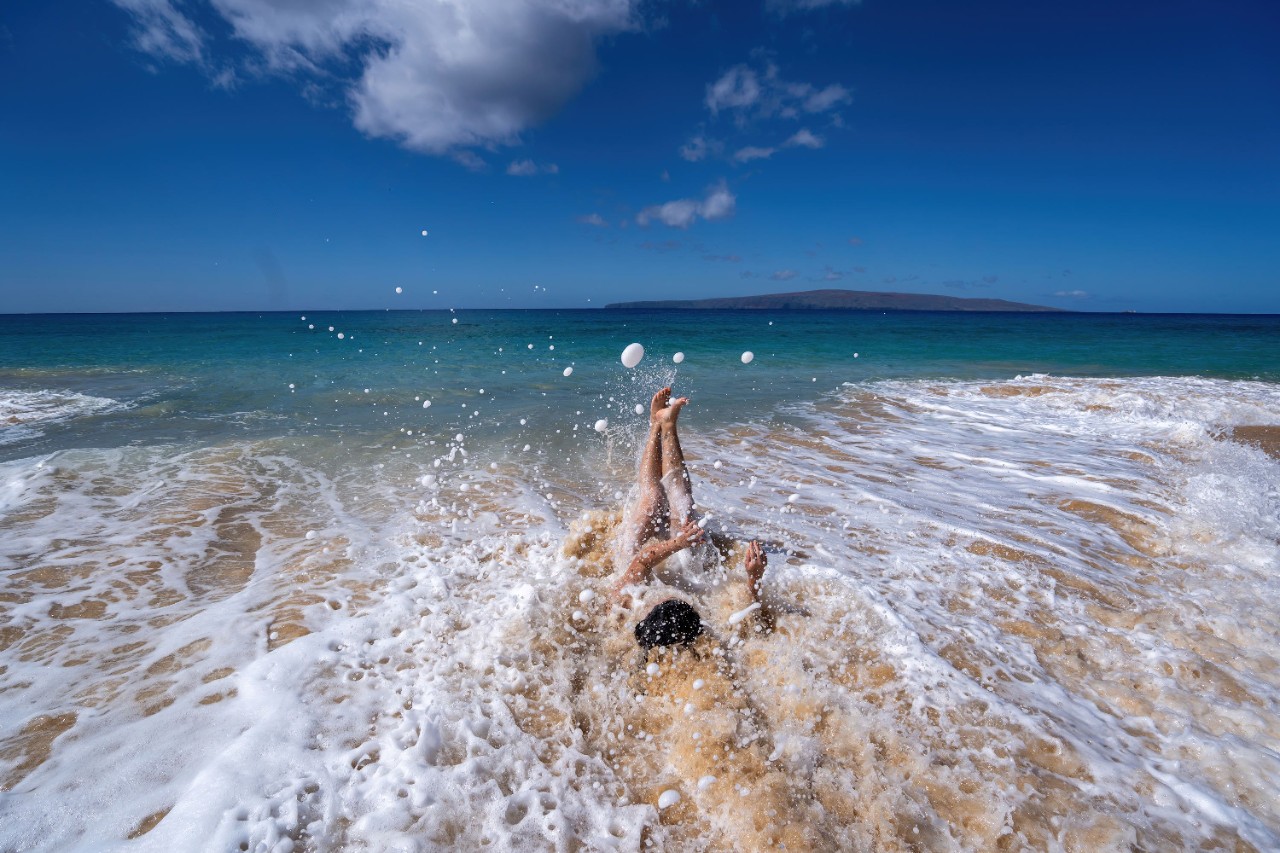 Woman in the waves at Makena Beach, Hawaii