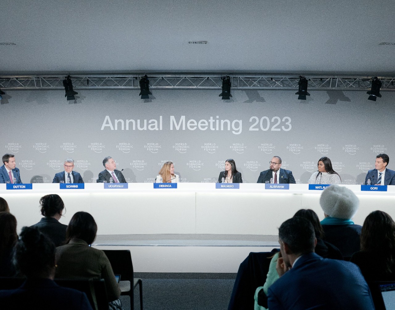 Uplink Annual meeting executives speaking at long table to audience