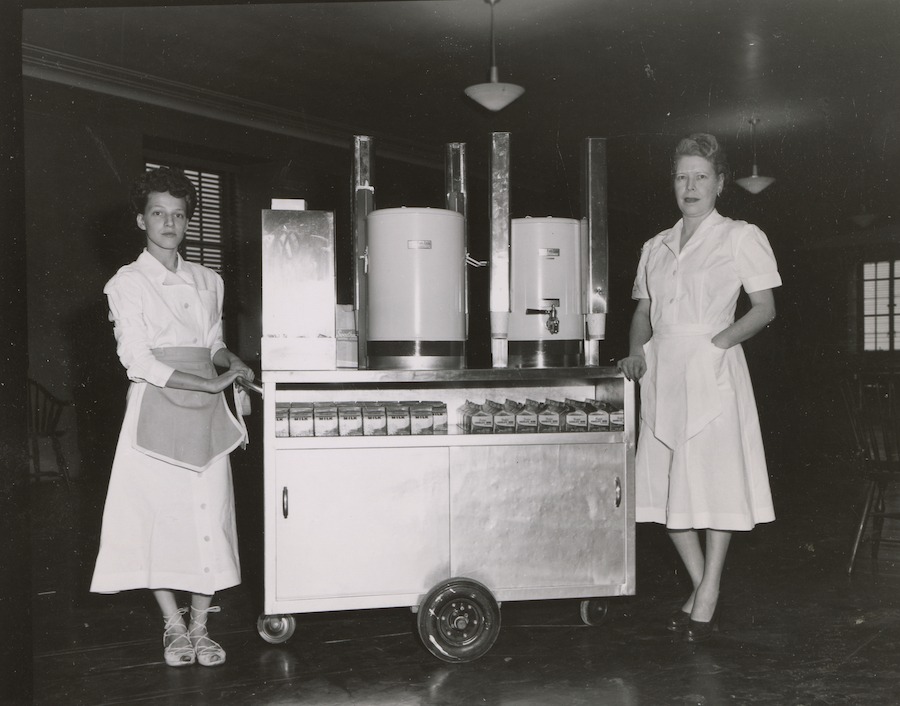 Two women operating barista cart 1925