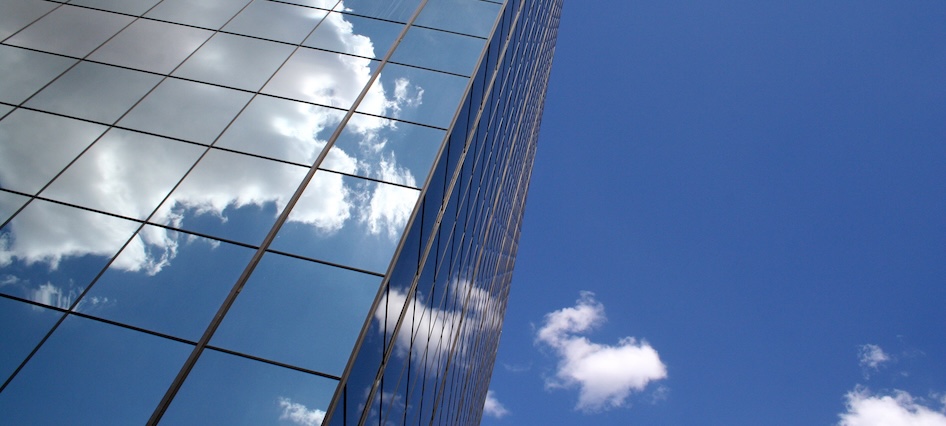 building windows with clouds reflected